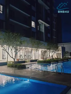 a swimming pool in front of a building at Minimalist Dual-Key Stay with 4BR at Farlim Penang in Ayer Itam
