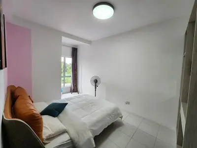 a white bedroom with a bed and a window at Sweet Home G12 Emerald Avenue in Brinchang
