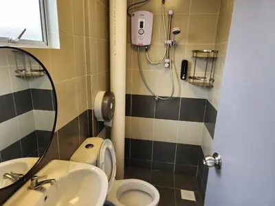 a bathroom with a sink and a toilet and a shower at 8-28 The Art Gallery Emeral Avenue in Brinchang