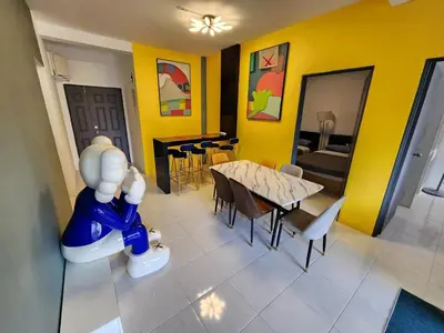 a view of a dining room with a table and chairs at 8-28 The Art Gallery Emeral Avenue in Brinchang