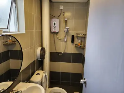 a bathroom with a shower and a toilet and a sink at 821 Camping Style in Brinchang