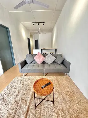 a living room with a couch with pillows on it at Cozyindah11A#7pax#netflix#NearAeonAlma#BukitMertajam in Bukit Mertajam