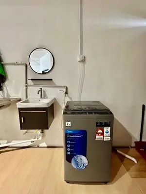 a hospital room with a sink and a trash can at Cozyindah11A#7pax#netflix#NearAeonAlma#BukitMertajam in Bukit Mertajam
