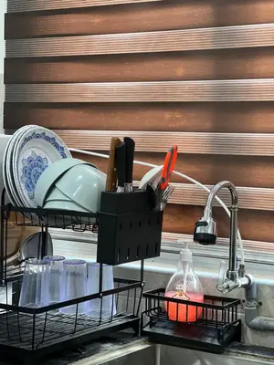 a kitchen sink with a dish drying rack with utensils at Nahyra Homestay, Múslīm Only, WIFI, Netflix, 4 Bilik in Sungai Petani