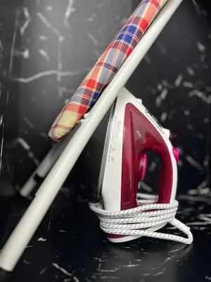 a pair of skis and a red telephone on a table at Nahyra Homestay, Múslīm Only, WIFI, Netflix, 4 Bilik in Sungai Petani