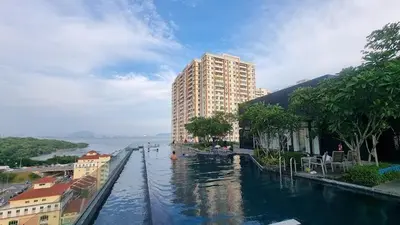 a river in a city with buildings and a building at Urban Suites Penang by Dynaz Homestay in Jelutong