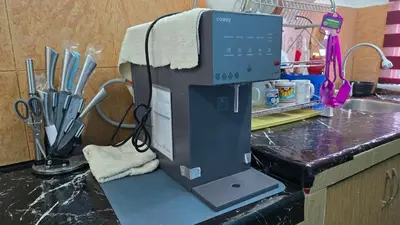 a computer sitting on top of a kitchen counter at Azura Homestay Seri Iskandar in Seri Iskandar