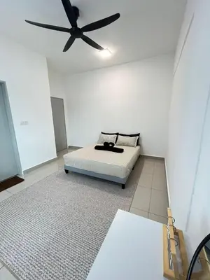 a room with a bed with a ceiling fan at M Retreat Cameron Highlands in Tanah Rata