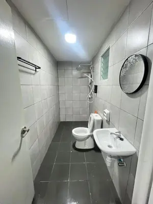 a bathroom with a toilet and a sink at M Retreat Cameron Highlands in Tanah Rata