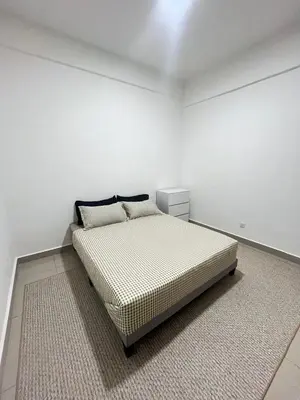 a bedroom with a bed in a white room at M Retreat Cameron Highlands in Tanah Rata