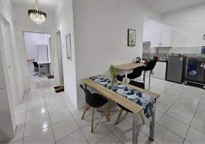 a kitchen and dining room with a table and chairs at Ipoh Anderson Condo - 2BR in Ipoh