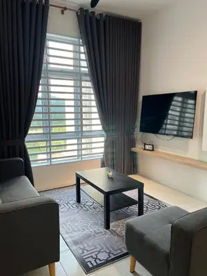 a living room with a couch and a coffee table at Ipoh Condo Anderson residence in Ipoh
