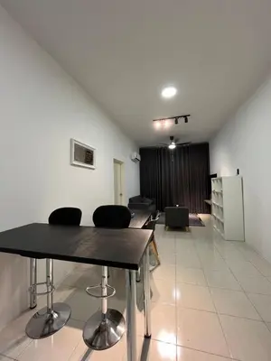 a room with a table and chairs in a room at Ipoh Condo Anderson residence in Ipoh