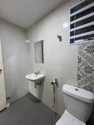 a bathroom with a toilet and a sink at Ipoh Condo Anderson residence in Ipoh