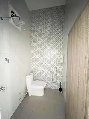 a bathroom with a toilet and a shower at Rumah Huda in Bukit Mertajam