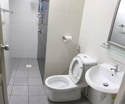 a bathroom with a toilet and a sink at StayIndah Homestay Cameron Highlands in Tanah Rata