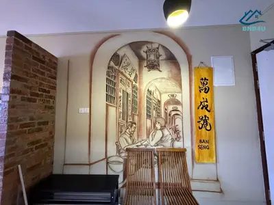a building with a mural on the wall at Duplex Comfort Stay in George Town in George Town