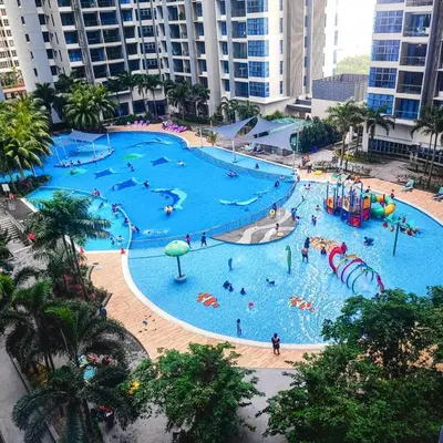 an overhead view of a large swimming pool with people in it at Rich Return Empire in Gua Sai