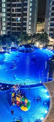 a large swimming pool with a water park at Rich Return Empire in Gua Sai