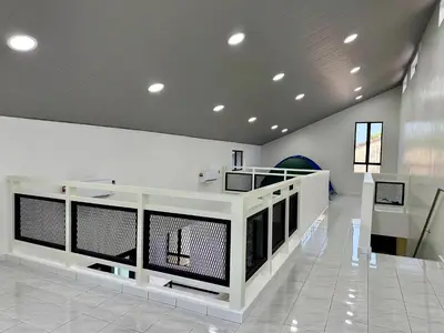 a lobby with a white counter in a building at \u5feb\u4e50\u5ba2\u6808 Sentosa Cottage in Raub