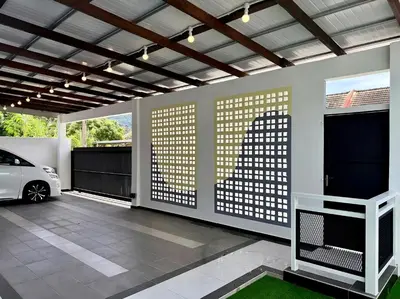 a garage with a car parked inside of it at \u5feb\u4e50\u5ba2\u6808 Sentosa Cottage in Raub