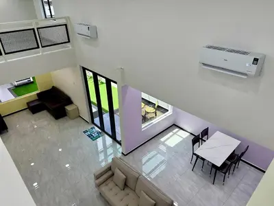 an overhead view of a living room with a table and chairs at \u5feb\u4e50\u5ba2\u6808 Sentosa Cottage in Raub