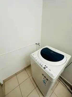 a white toilet with a blue seat in a bathroom at Seaview Condo A31 #Queensbay#SPICE in Bayan Lepas