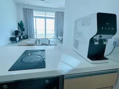 a kitchen with a counter top with a microwave at Seaview Condo A31 #Queensbay#SPICE in Bayan Lepas