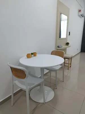 a white table and chairs in a room at Studio Unit Marc Residence in Bukit Mertajam