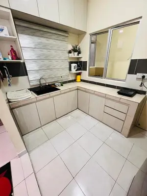 a kitchen with a sink and a large window at Rayyan'Homestay PMCJ in Tanah Rata