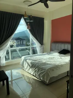 a bedroom with a bed and a large window at Rayyan'Homestay PMCJ in Tanah Rata