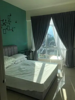 a bedroom with a bed and a large window at Rayyan'Homestay PMCJ in Tanah Rata
