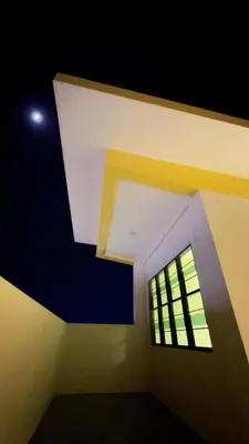 a room with a window and a ceiling at AP Homestay in Sekincan
