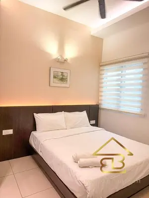 a bedroom with a large bed with aigil on it at Ipoh City Centre Penthouse 12-15 Pax KTV BBQ in Ipoh