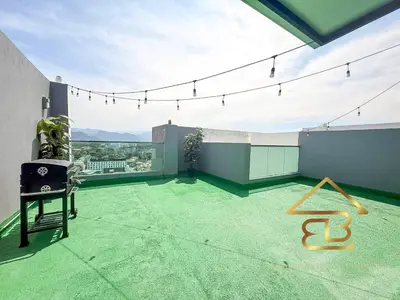 a room with a green carpeted floor on a building at Ipoh City Centre Penthouse 12-15 Pax KTV BBQ in Ipoh