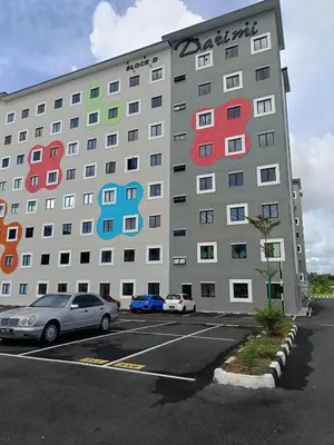 a large building with colorful windows in a parking lot at WiU Cottage, Seri Iskandar in Seri Iskandar