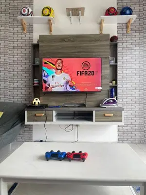 a flat screen tv sitting on top of a table at Ayaan Fifa Home Juniors with Netflix and Ps4 Games in Tanah Rata