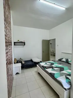 a bedroom with a bed and a mirror in it at Ayaan Fifa Home Juniors with Netflix and Ps4 Games in Tanah Rata