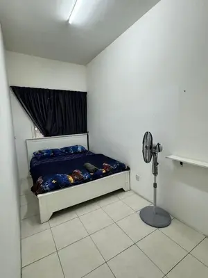 a bedroom with a bed in a room with a fan at Ayaan Fifa Home Juniors with Netflix and Ps4 Games in Tanah Rata