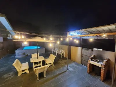 a patio with a table and chairs and a pool at Asu Homestay w Private Pool - Batu Gajah,Perak in Batu Gajah