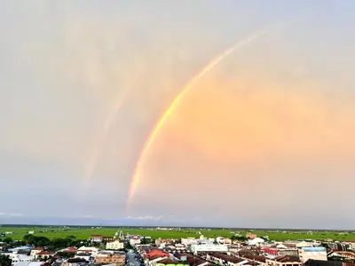 a double rainbow in the sky over a city at \u7a3b\u5cb8 DaoAn Homestay-with balcony in Sekincan