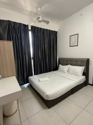a bedroom with a bed and a window with black curtains at Urban Suites Home Suites by Twinkle Loft in George Town