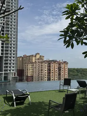 a patio with chairs and a view of a city at Urban Suites Home Suites by Twinkle Loft in George Town