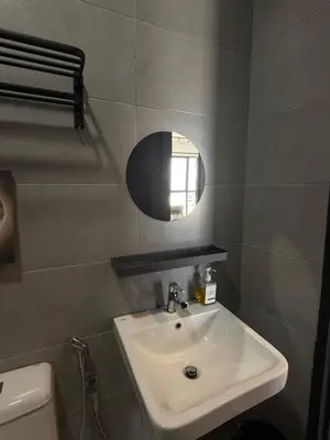 a bathroom with a sink and a mirror at Urban Suites Home Suites by Twinkle Loft in George Town