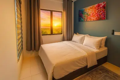 a bed in a room with a window at Radif Homestay Seri Iskandar#1 in Kampong Bota Road
