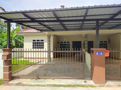a pergola over a house with a gate at Teratak Desa Cemerlang 1