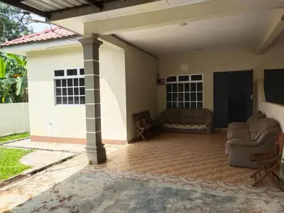 a living room of a house with a couch at Teratak Desa Cemerlang 1