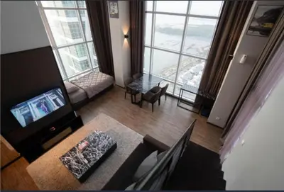 a living room with a view of a living room at Maritime suite Karpal sign sea view in George Town