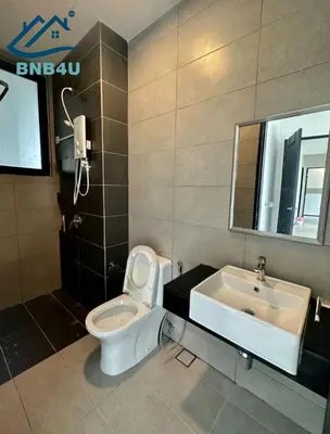 a bathroom with a toilet and a sink at Urban Suites Apartment In Jelutong George Town in George Town