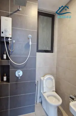 a bathroom with a toilet and a shower in it at Urban Suites Apartment In Jelutong George Town in George Town